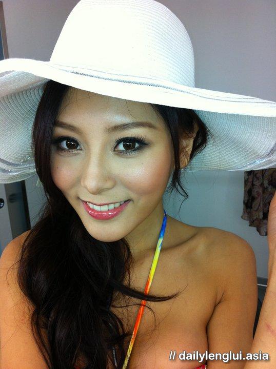 Jeana Ho in a bikini taking a selfie