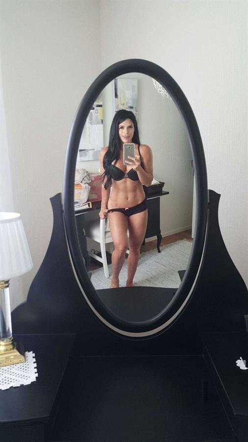 Michelle Lewin in a bikini taking a selfie