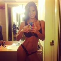Michelle Lewin in a bikini taking a selfie