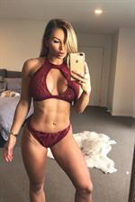 Amy Lee Summers in a bikini taking a selfie