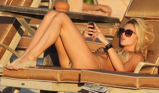 Abigail Clancy in a bikini - ass