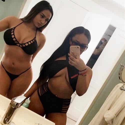 Astrid Nelsia in a bikini taking a selfie