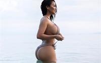 Dolly Castro in a bikini taking a selfie