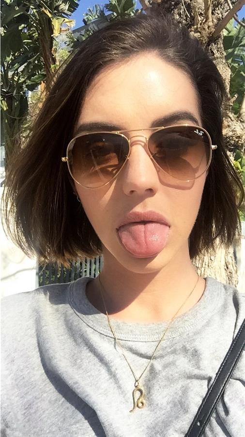 Adelaide Kane taking a selfie