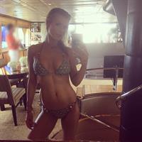 Joanna Krupa in a bikini taking a selfie
