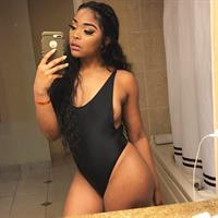 Tiara Yvonne in a bikini taking a selfie