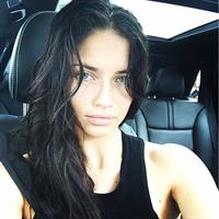 Adriana Lima taking a selfie