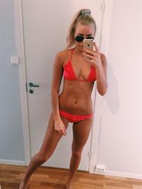 Anonymous in a bikini taking a selfie
