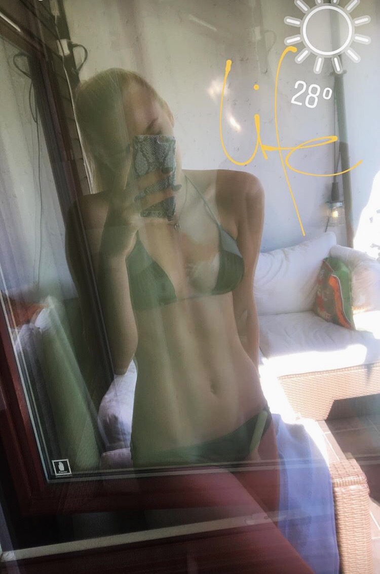 Anonymous in a bikini taking a selfie