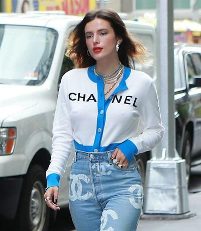 Bella Thorne braless tits seen by paparazzi showing her pierced nipple dressed all in Chanel.






