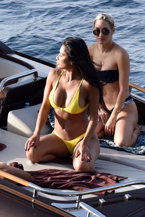 Nicole Scherzinger Bikini Pictures Nicole Scherzinger in a sexy bikini on a boat in Capri showing her ass and nice cleavage seen by paparazzi.