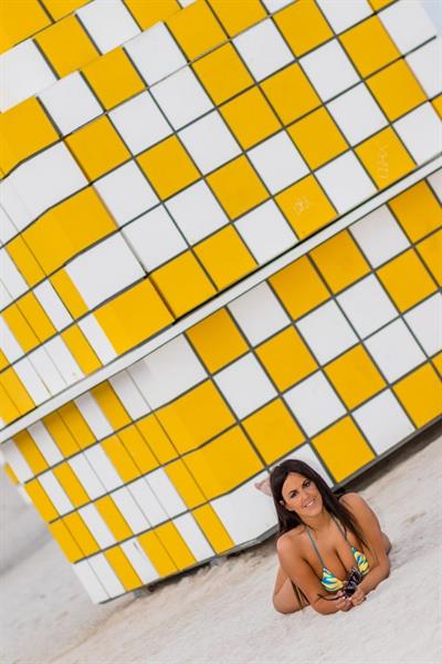 Claudia Romani sexy doing yoga at the beach in a thong bikini showing off her boobs and ass seen by paparazzi.




















