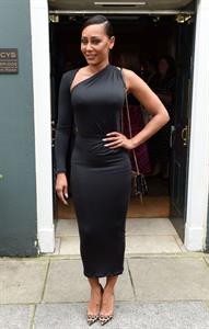 Mel B braless boobs in a black dress seen by paparazzi.






