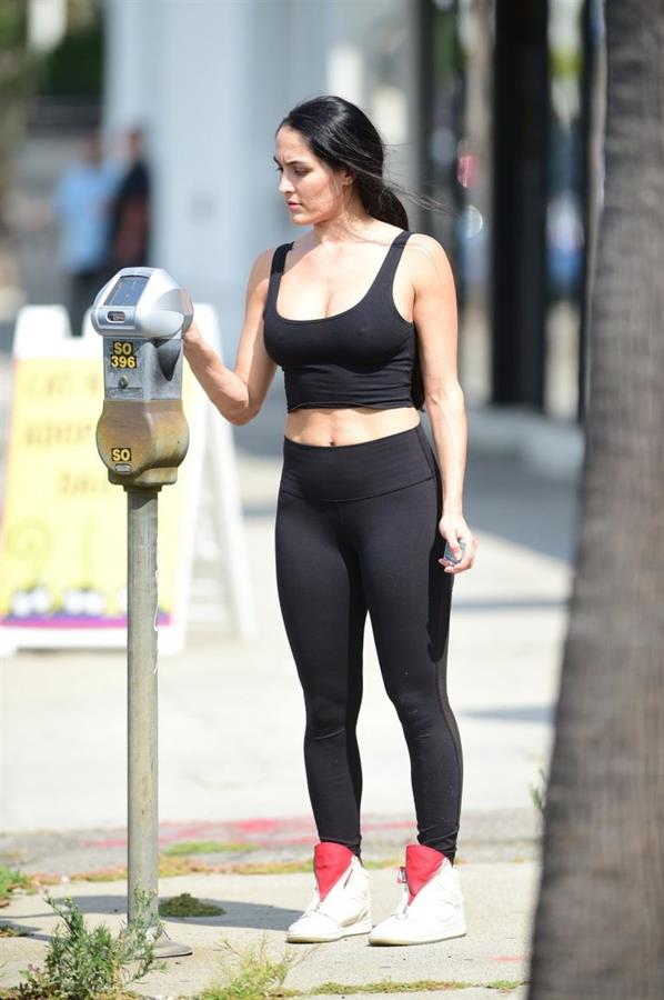Nikki Bella braless in a see through top showing her boobs seen by paparazzi.







