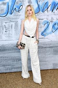 Ellie Bamber braless boobs while wearing basically a scarf as a top showing side boob cleavage.








