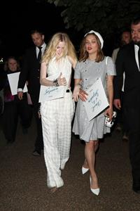 Ellie Bamber braless boobs while wearing basically a scarf as a top showing side boob cleavage.








