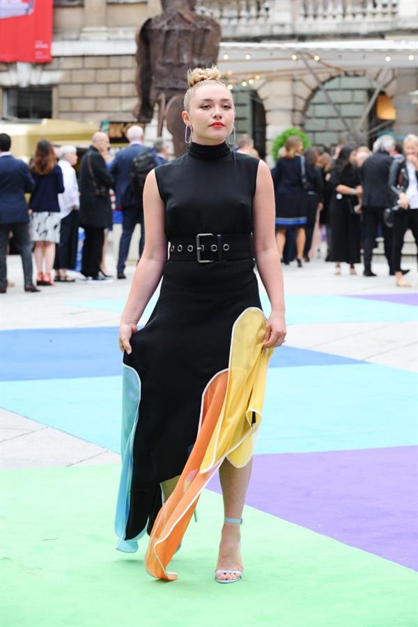 Florence Pugh braless tits pokies in a black dress.















