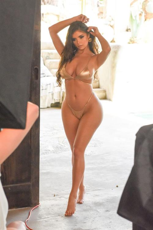 Demi Rose Mawby Bikini Pictures Demi Rose in a sexy gold thong bikini showing off her famous cleavage.