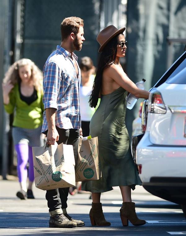 Nikki Bella braless boobs in a green dress seen by paparazzi.
















