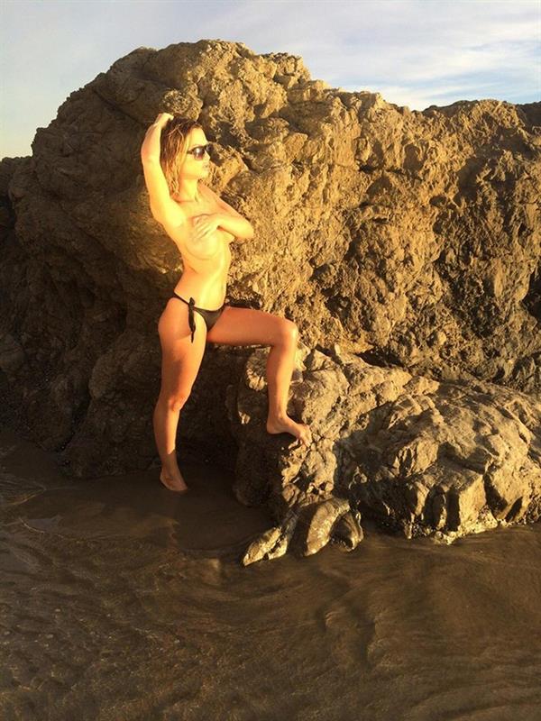 Ella Rose in a topless beach photoshoot