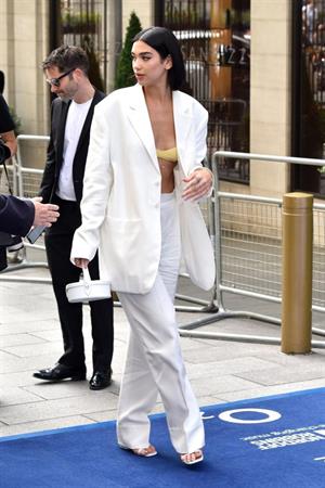 Dua Lipa looking hot in a sexy revealing top seen by paparazzi.





