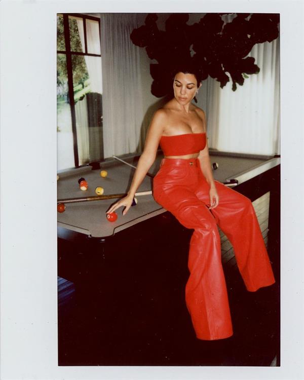 Kourtney Kardashian sexy cleavage sitting on her pool table looking like she wants to get fucked on it.















