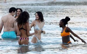 Kendall Jenner sexy ass in a thong bikini seen by paparazzi in the water at the beach.





























