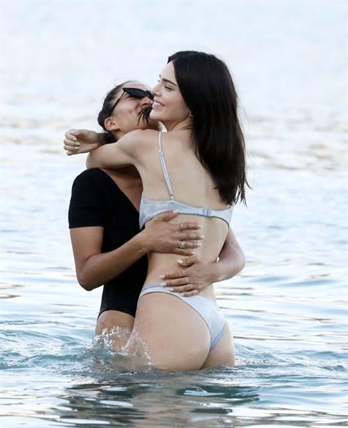 Kendall Jenner sexy ass in a thong bikini seen by paparazzi in the water at the beach.




























