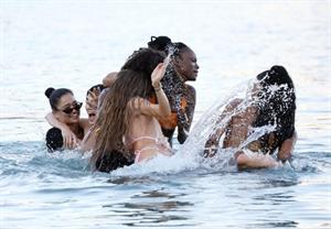 Kendall Jenner sexy ass in a thong bikini seen by paparazzi in the water at the beach.




























