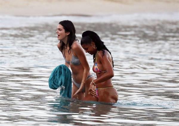 Kendall Jenner sexy ass in a thong bikini seen by paparazzi in the water at the beach.




























