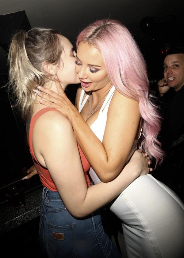 Jessika Power sexy lesbian kiss out partying in a white dress showing some nice cleavage.





