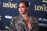Beyonce braless boobs and areola peek showing off nice cleavage on the red carpet for the premiere of  The Lion King .







