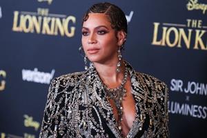 Beyonce braless boobs and areola peek showing off nice cleavage on the red carpet for the premiere of  The Lion King .






