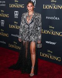 Beyonce braless boobs and areola peek showing off nice cleavage on the red carpet for the premiere of  The Lion King .






