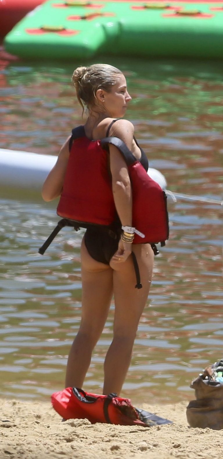 Elsa Pataky Bikini Pictures Elsa Pataky sexy ass and cleavage in a swimsuit seen by paparazzi with Chris Hemsworth.