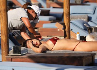 Alessandra Ambrosio Bikini Pictures Alessandra Ambrosio topless and sexy at the beach in a thong bikini showing off her perfect model ass and boobs.