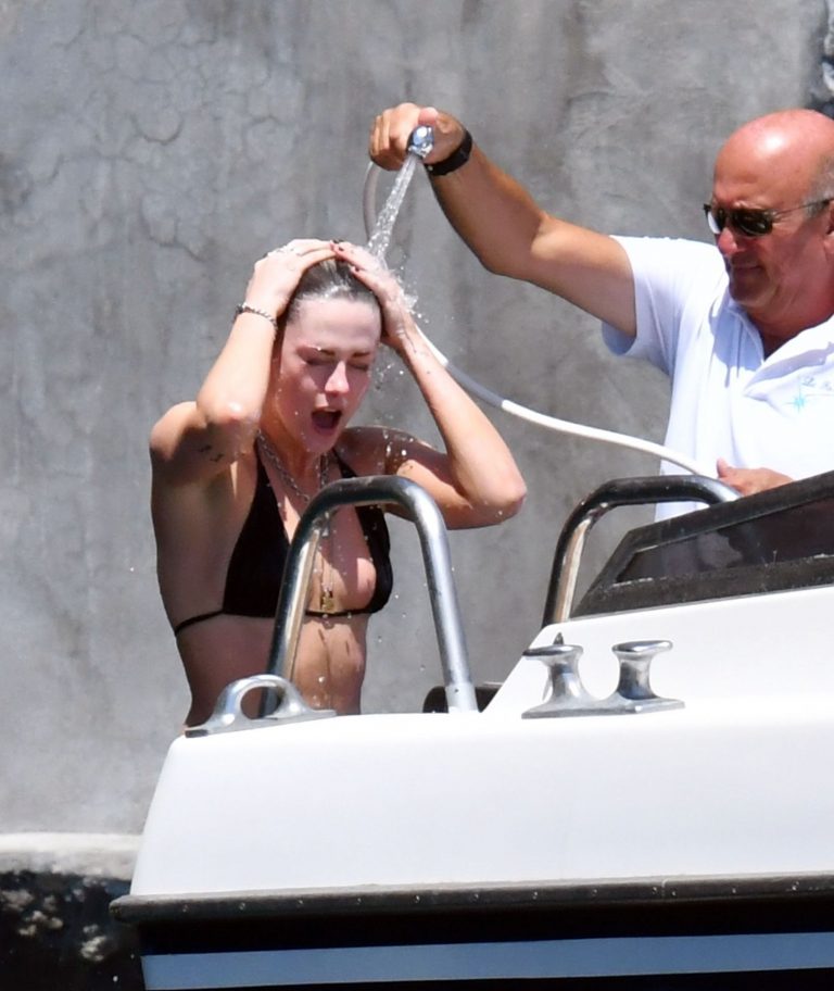 Kristen Stewart Bikini Pictures Kristen Stewart nude boobs caught topless by paparazzi tanning on a boat.