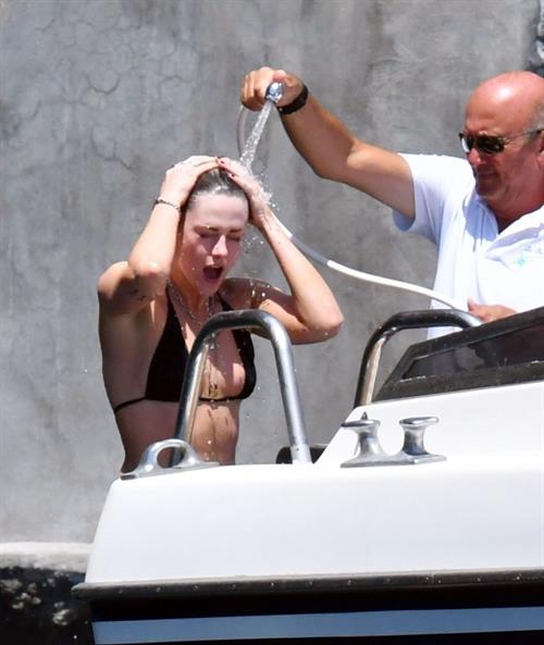 Kristen Stewart Bikini Pictures Kristen Stewart nude boobs caught topless by paparazzi tanning on a boat.
