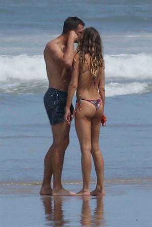 Gisele Bundchen sexy ass in a thong bikini at the beach seen by paparazzi with Tom Brady.

