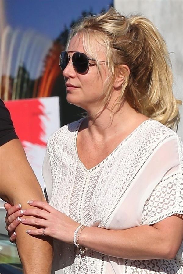 Britney Spears braless boobs in a see through blouse showing her nipples seen by paparazzi.


