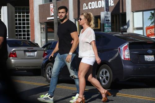 Britney Spears Pictures Britney Spears braless boobs in a see through blouse showing her nipples seen by paparazzi.