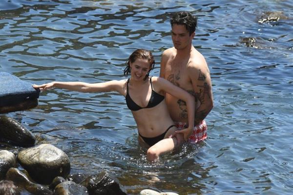 Zoey Deutch sexy boobs and ass in a little bikini in the water seen by paparazzi.



















