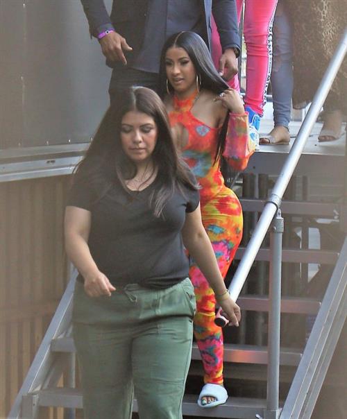 Cardi B Pictures Cardi B boobs and booty on display on and off stage showing nice cleavage and her sexy ass in a tight dress.