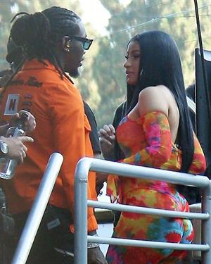 Cardi B boobs and booty on display on and off stage showing nice cleavage and her sexy ass in a tight dress.























