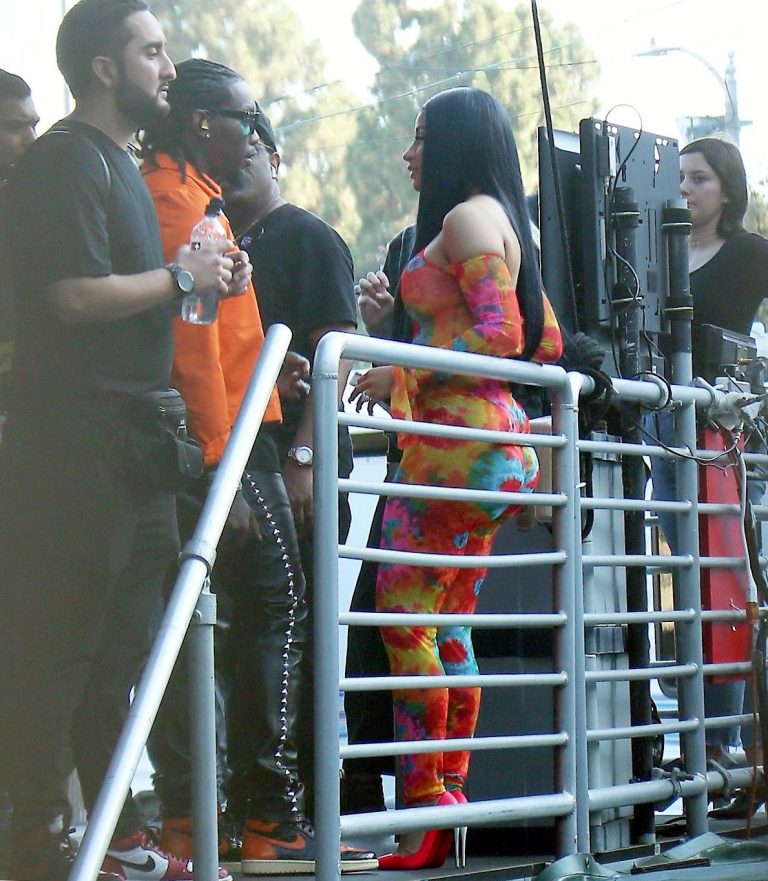 Cardi B boobs and booty on display on and off stage showing nice cleavage and her sexy ass in a tight dress.























