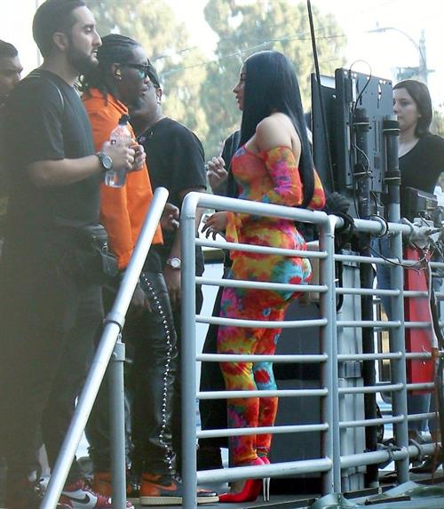 Cardi B boobs and booty on display on and off stage showing nice cleavage and her sexy ass in a tight dress.























