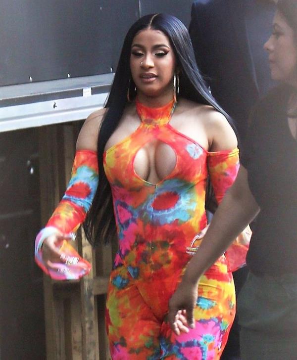 Cardi B boobs and booty on display on and off stage showing nice cleavage and her sexy ass in a tight dress.























