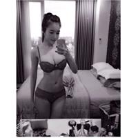 Elly Tran Ha in lingerie taking a selfie