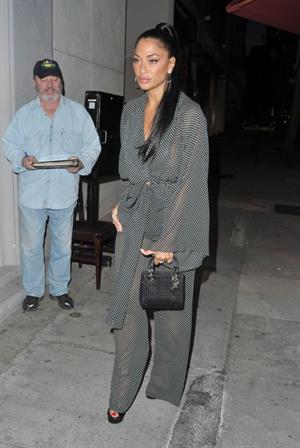 Nicole Scherzinger sexy in a see through outfit showing her braless boobs and ass seen by paparazzi.

