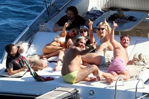 Kristen Stewart and Stella Maxwell sexy lesbians making out on a boat in bikinis seen by paparazzi.










